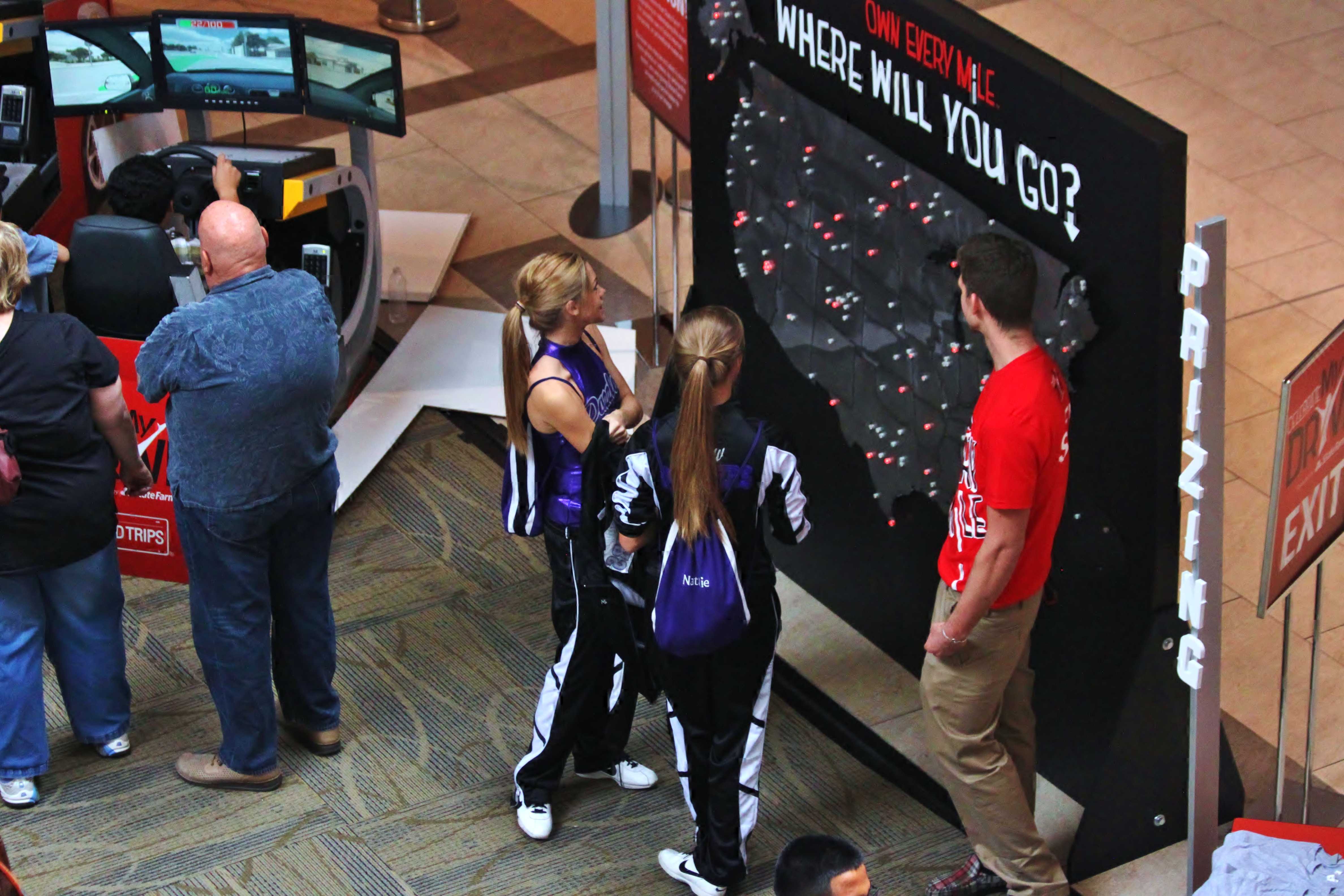 In addition to dancing with the Dazzler dance team, juniors Megan McConnell and Natalie Pyle walk around to the various stations at the Celebrate My Drive event. “Being on Dazzlers has given me the opportunity to perform in places I would never even think of.” Pyle said.