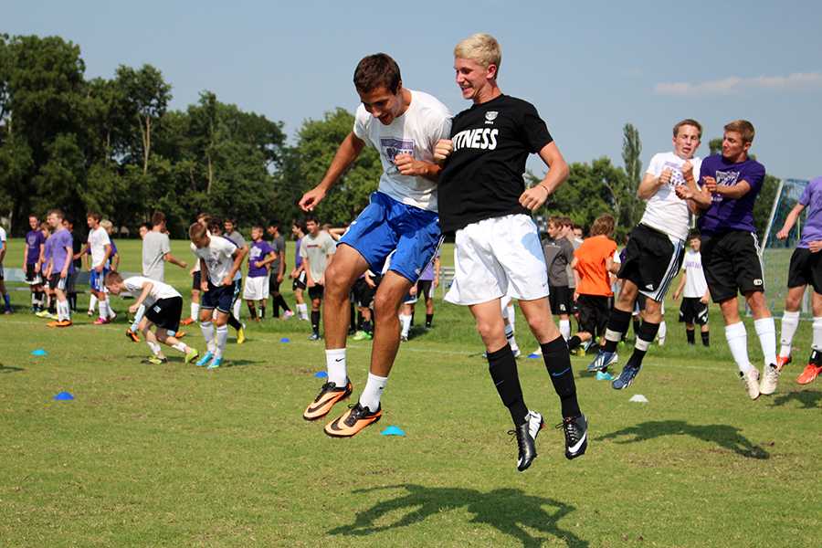 Varsity soccer seniors Colton Southwell and Taylor  Wiebke get excited for the season at last weeks practice.