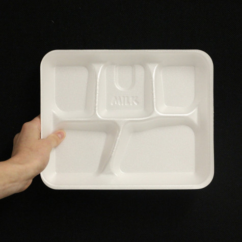 A letter from a styrofoam tray