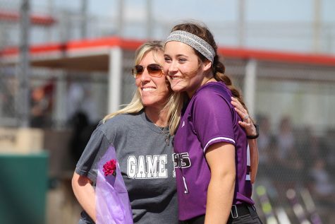 Varsity softball splits double header with St. James