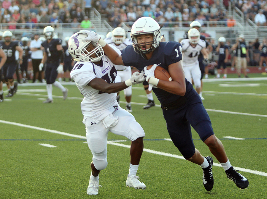 Sophomore Edward Thomas (28) gets stiff armed trying to tackle a Mill Valley wide receiver at Mill Valley Sept. 8.  