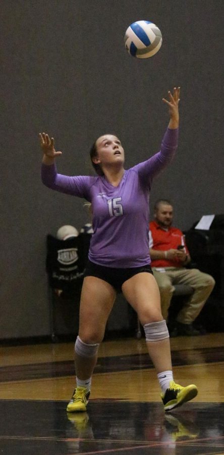 BVNW senior Anna Chalupa (15) prepares to serve the ball at Blue Valley West Oct. 21.