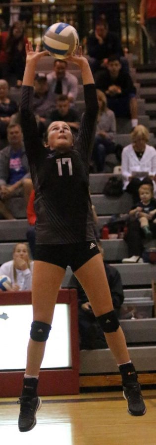 BVNW sophomore Camryn Honn (17) sets the ball at Blue Valley West High School Oct. 21.