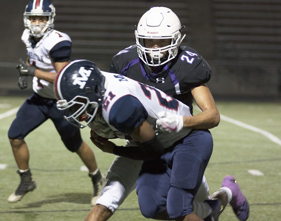 BVNW senior Kordell Simmons (24) tackles a Manhattan player at the DAC Oct. 20.