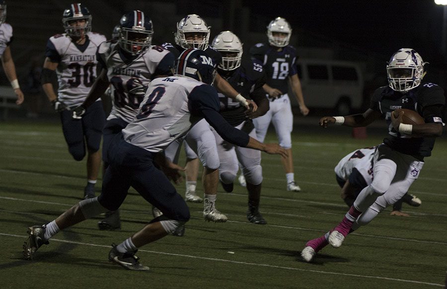 BVNW sophomore Edward Thomas (28) tries to avoid a Manhattan defender at the DAC Oct. 20.