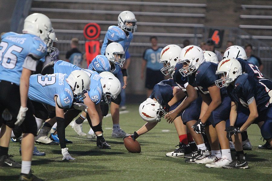 Oxford Middle School and Harmony Middle School players line up ready for a play during the first half of the HMS-OMS feeder game Oct. 3 at the DAC.