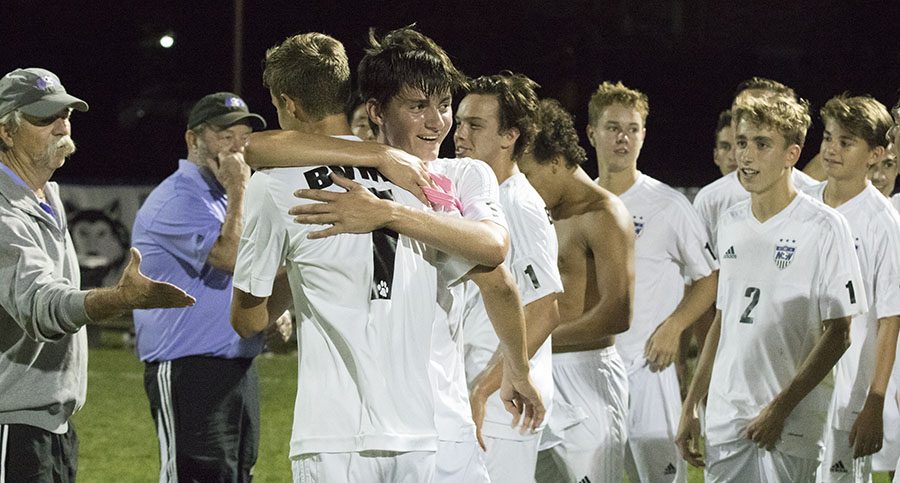BVNW players celebrate after their overtime win against Olathe East at the DAC Oct. 3.