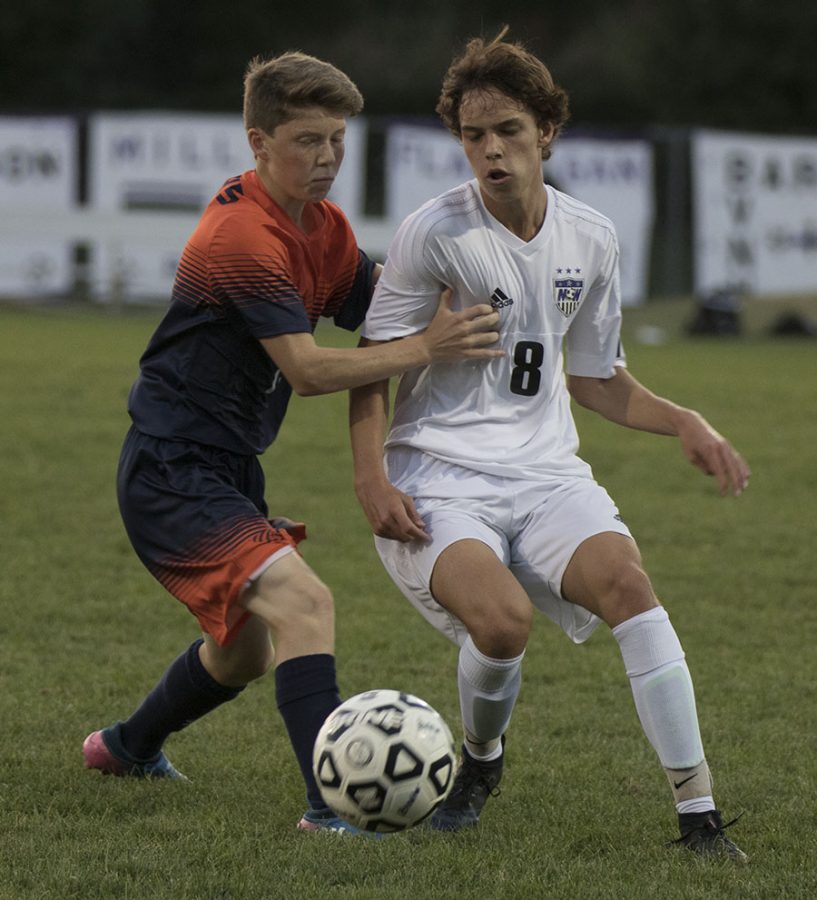 BVNW sophomore Dylan Colle (8) battles for the ball against an Olathe East player at the DAC Oct. 3.