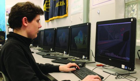 Junior Sam Rauter plays a computer game. Rauter is the President of the eSports club. 