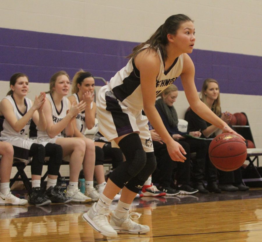 Blue Valley Northwest senior guard Haley Shin (11) dribbles the ball during the fourth quarter of last years matchup with Pittsburg High at PHS Jan. 20. The Huskies defeated the Purple Dragons, 54-29. 