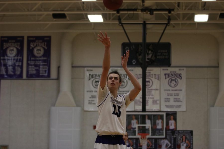 Blue Valley Northwest senior forward Parker Braun (23) shoots a free throw during the third quarter of the Huskies matchup with East at BVNW Jan. 30. The Huskies defeated the Bears, 87-28.