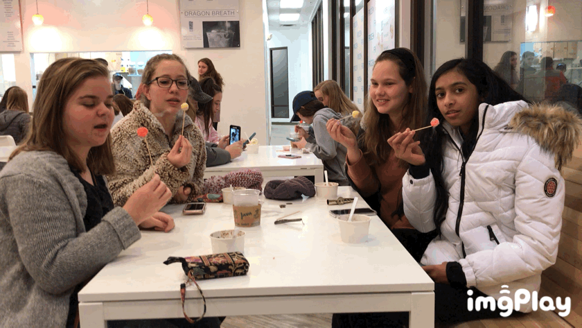 As the liquid nitrogen escapes their mouths, freshmen Annie Fischer (back left), Camryn Yearot (back right), Nandini Rainikindi (front right), Betsie Yeomans (front left) laugh from the frozen treat.
