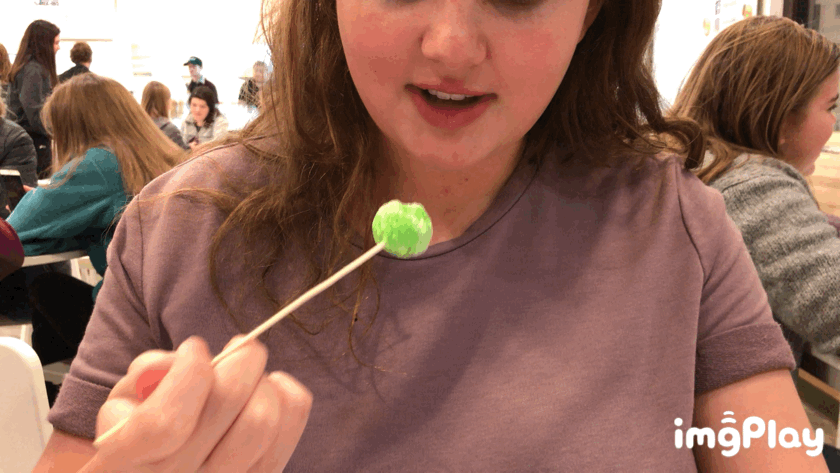Sophomore staff writer Olivia Dowell uses a giant toothpick to eat the Dragon Breath.