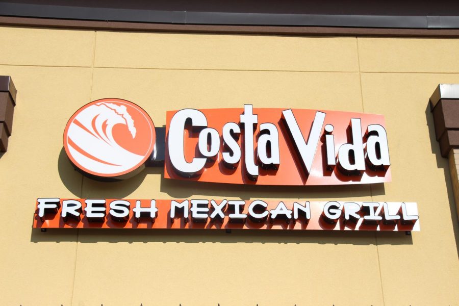 The exterior of Costa Vida is black and orange, the lettering is raised off the exterior wall and reads: Costa Vida: Fresh Mexican Grill.