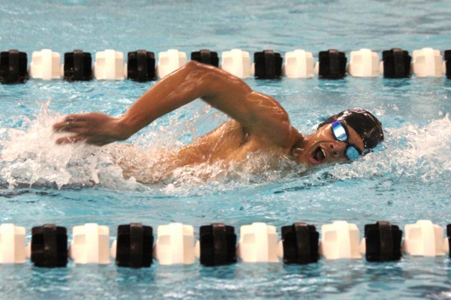 Senior JP Larson swims in a meet during the 2017-18 season.