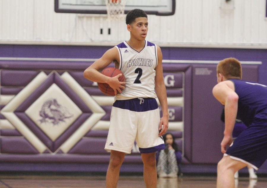 Blue Valley Northwest senior guard Max Johnson (2) watches the clock before running a play during the Huskies matchup with Pittsburg High at PHS Jan. 20. The Huskies defeated the Purple Dragons, 68-41.