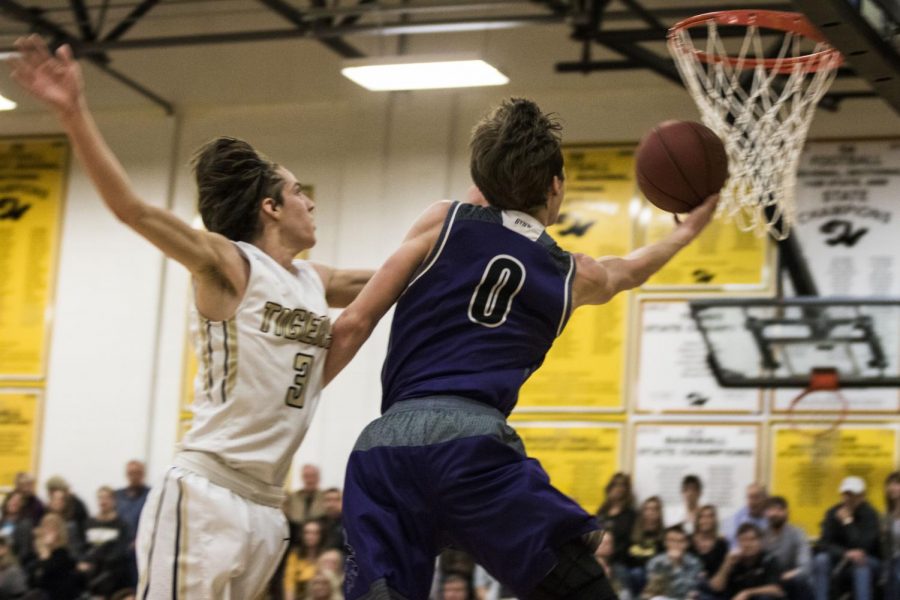 Blue+Valley+Northwest+junior+guard+Christian+Braun+%280%29+extends+for+a+layup+during+the+first+half+of+the+Huskies+matchup+with+Blue+Valley+at+BVHS+Feb.+16.+The+Huskies+defeated+the+Tigers%2C+56-27.