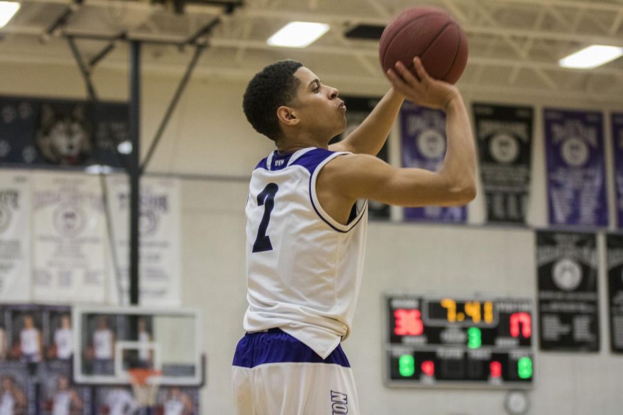Blue+Valley+Northwest+senior+guard+Max+Johnson+%282%29+shoots+a+3-pointer+during+the+third+quarter+of+the+Huskies+matchup+with+St.+James+Academy+at+BVNW+Feb.+23.+The+Huskies+defeated+the+Thunder%2C+56-23.+