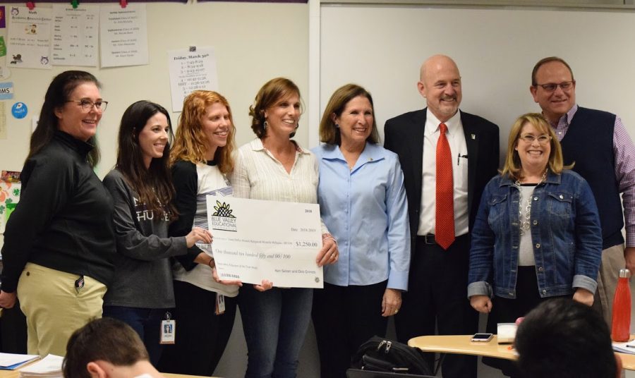 Principal Amy Murphy and district employees present Laura Deffer, Michele Ratigan and Michelle Williams with their Innovative Educators Award. 