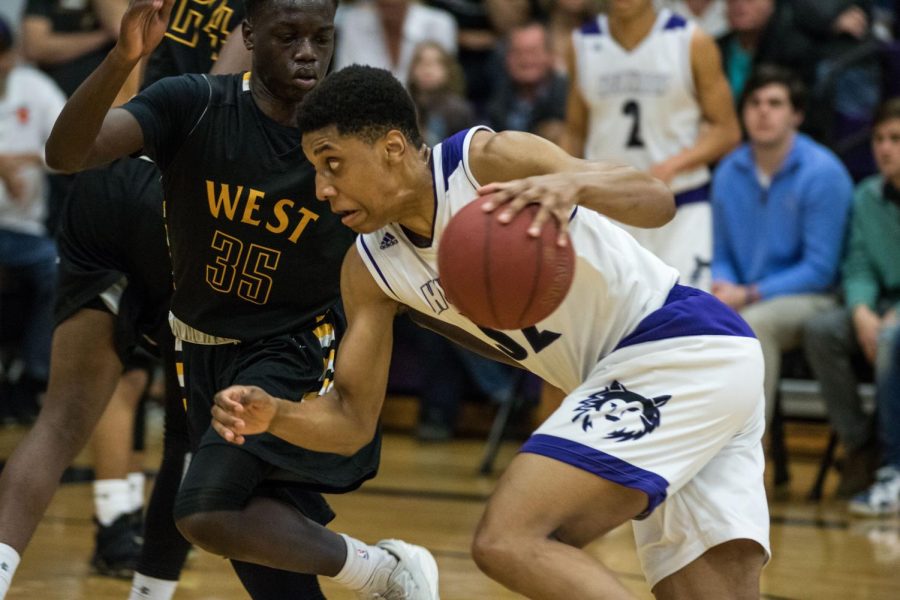 Blue+Valley+Northwest+senior+forward+Joe+Pleasant+%2832%29+drives+the+ball+during+the+first+half+of+the+Huskies+matchup+with+Shawnee+Mission+West+at+BVNW+March+3.+The+Huskies+defeated+the+Vikings%2C+67-36.