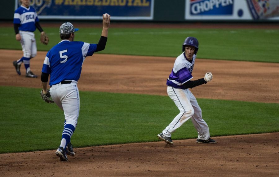 Sophomore Matt Miller gets caught in a rundown during the bottom of the fourth inning of the Huskies matchup with Summit Christian Academy at Kauffman Stadium April 21. The Huskies defeated the Eagles, 6-2. 