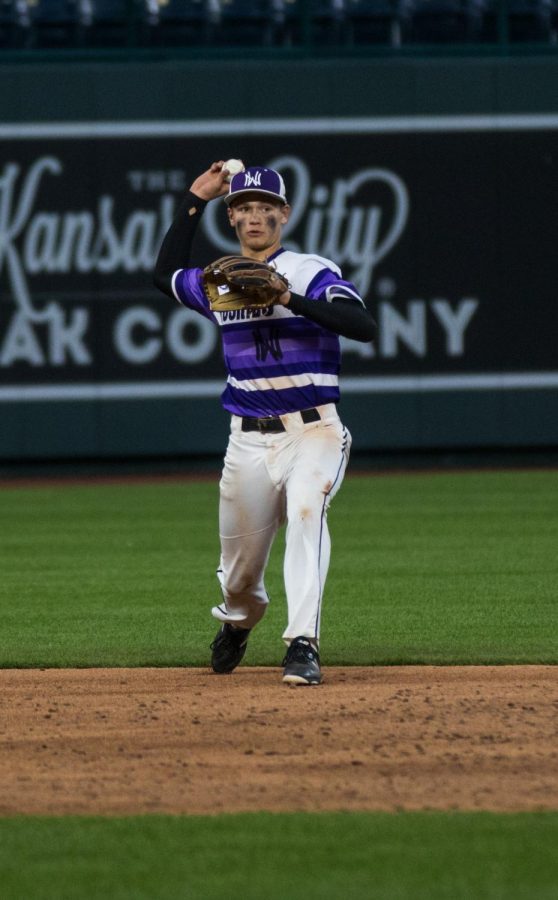 Sophomore shortstop Ryan Callahan throws the ball during the Huskies matchup with Summit Christian Academy at Kauffman Stadium April 21. The Huskies defeated the Eagles, 6-2. 