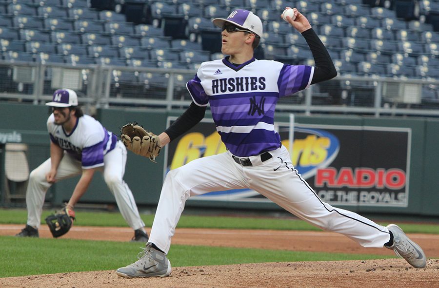 Senior Scott Duensing pitches during the top of the first inning of the Huskies matchup with Summit Christian Academy at Kauffman Stadium April 21. The Huskies defeated the Eagles, 6-2. 