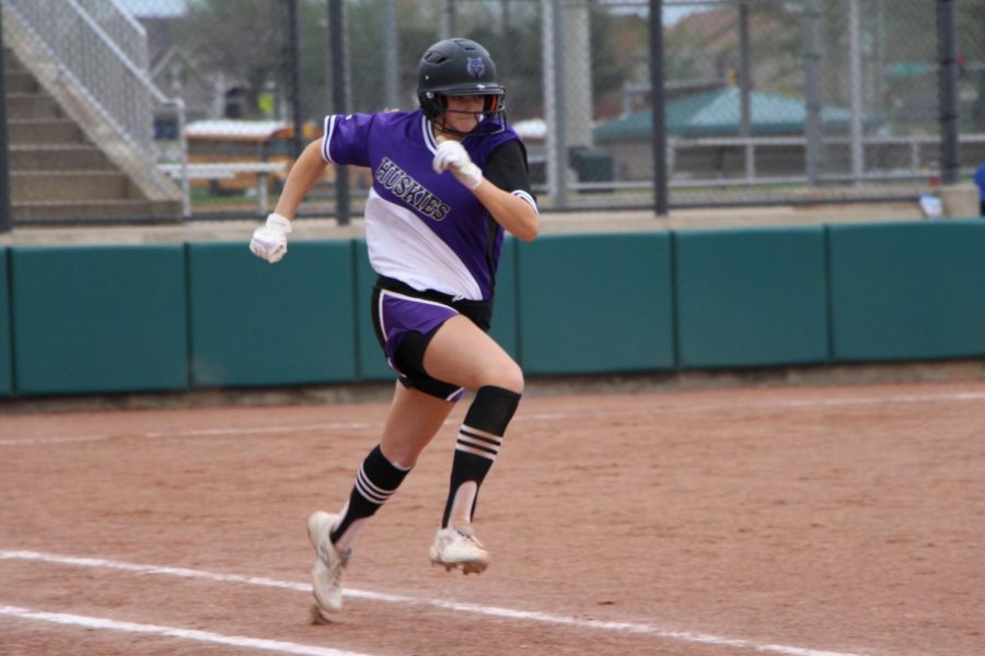 Junior Sadie Varhall runs to first base during the first game of the Huskies doubleheader against Bishop Miege May 1. The Huskies defeated the Stags, 12-1 and 15-0 in the doubleheader.