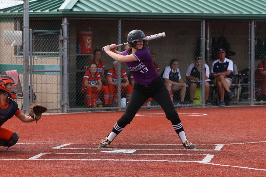Sophomore Julia Breidenthal prepares to swing during the Huskies matchup with Olathe East May 15. The Huskies lost to the Hawks, 2-1. 