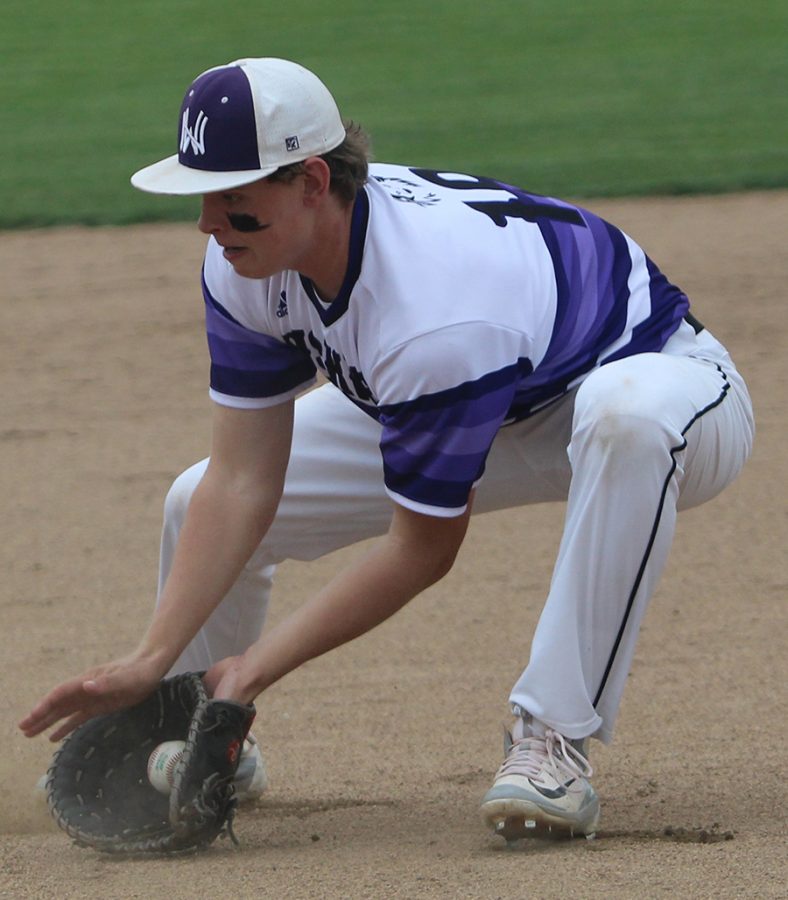 Senior Holden Missey fields a ground ball in the bottom of the fifth inning of the Huskies matchup with Bishop Miege May 1. The Huskies defeated the Stags, 4-3. 