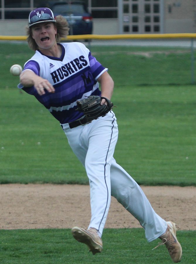 Senior Drew Black throws the ball to first base after fielding a ground ball in the bottom of the sixth inning of the Huskies matchup with Bishop Miege May 1. The Huskies defeated the Stags, 4-3. 