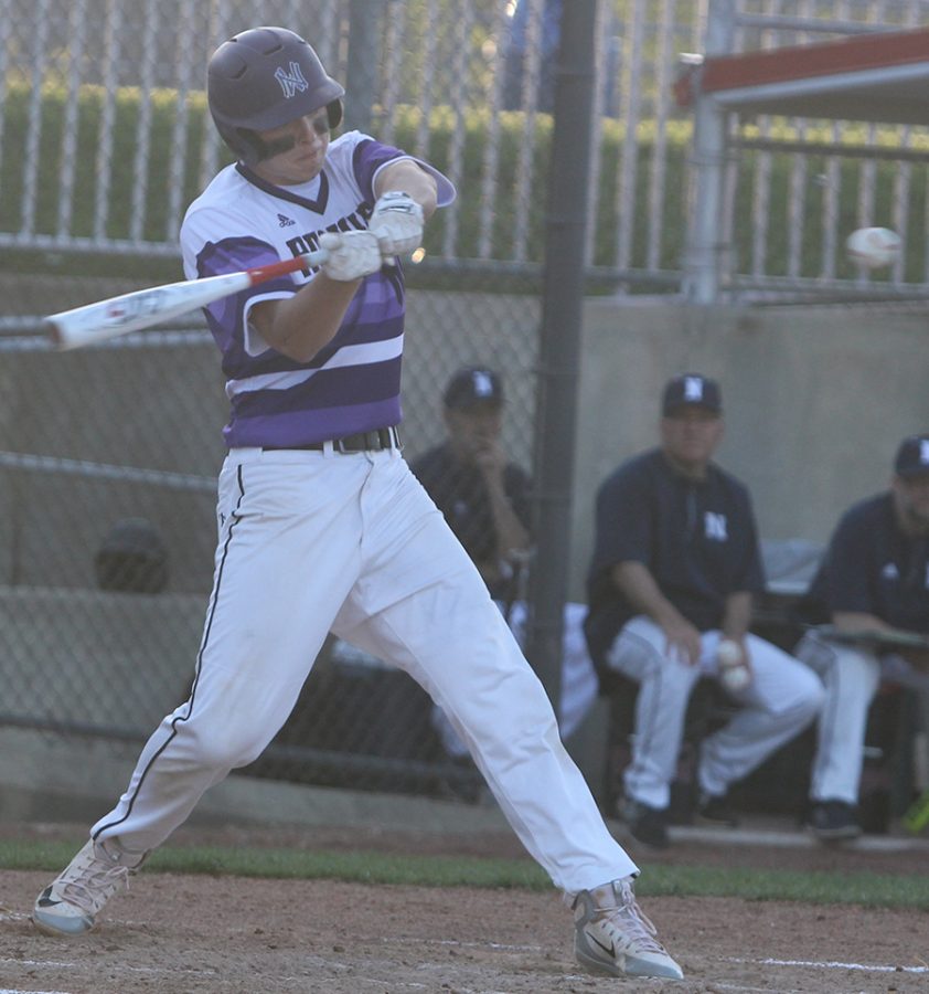 Senior first baseman Holden Missey hits a double against Blue Valley North at the DAC May 4. The Huskies defeated the Mustangs 5-1.