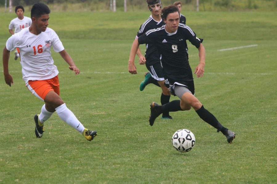 Senior Dylan Colle dribbles the ball against Shawnee Mission Northwest on Aug. 29, 2018 Blue Valley West. BVNW defeated SMNW, 3-1.