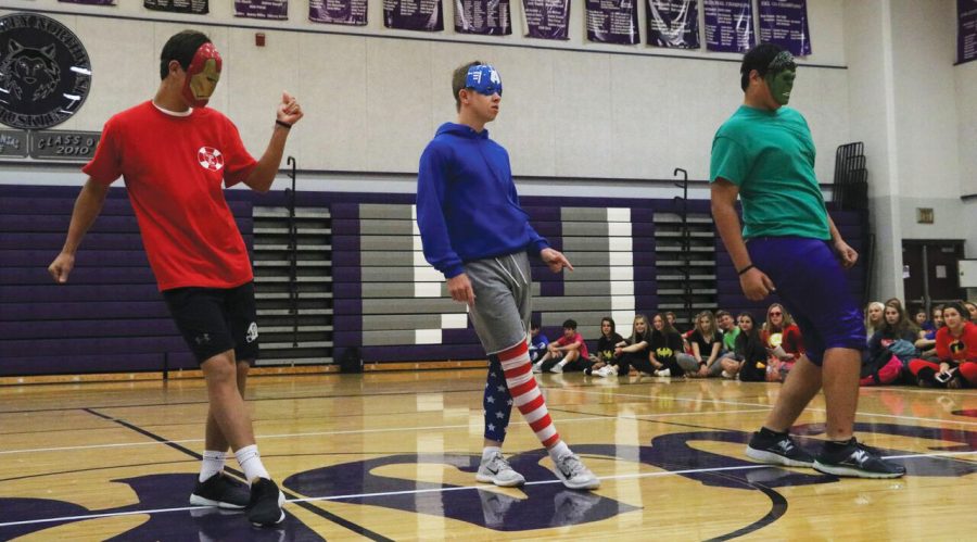 Juniors Jackson Mehlin, Nick Marker and Danny Robinson perform during the junior superhero day skit on Tuesday Sept. 25.