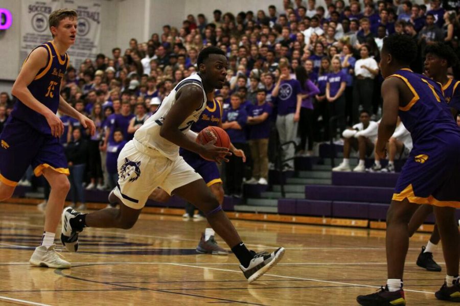 Senior Markell Hood carries toward the basket during the game against Blue Springs, Nov. 30. BVNW defeated BSHS, 70-40.