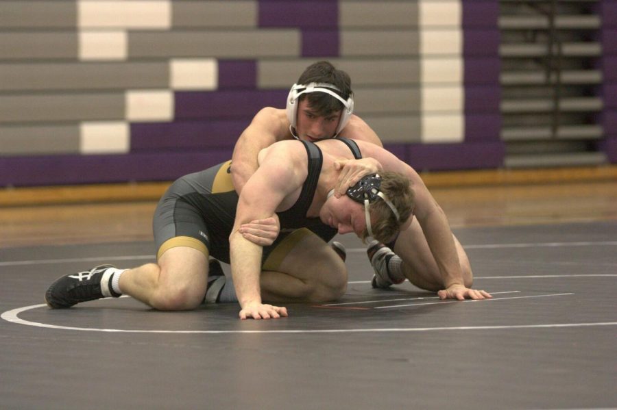 Sophomore Caiden Casella wrestles in a meet on Dec. 13 at Blue Valley. 