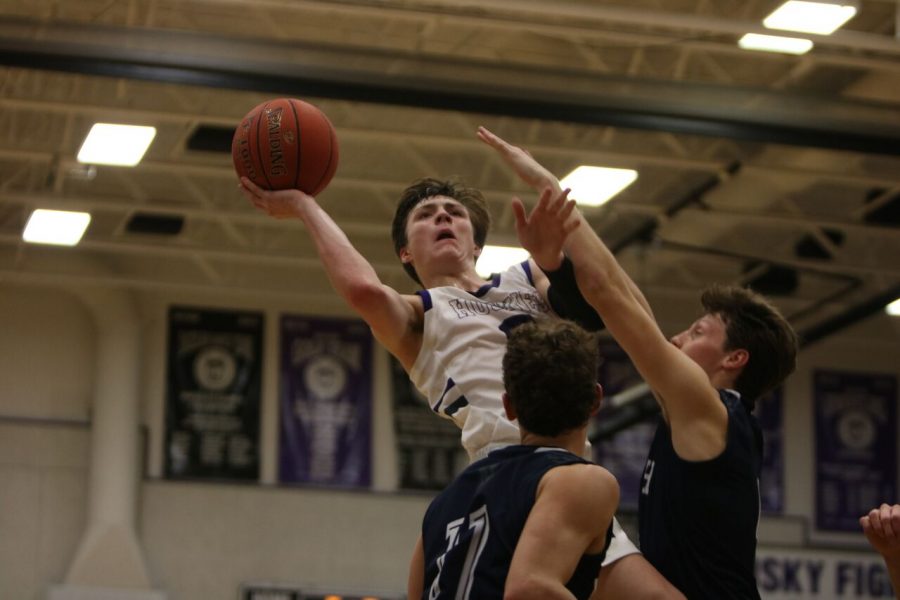 Senior Christian Braun elevates over two BVN to put up a shot during their matchup Friday Jan. 11.  BVNW defeated BVN 72-56.