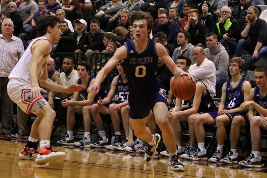 Senior Christian Braun drives in the game against Blue Valley West on Friday Feb. 8 at BVW. BVNW defeated BVW, 57-49. 