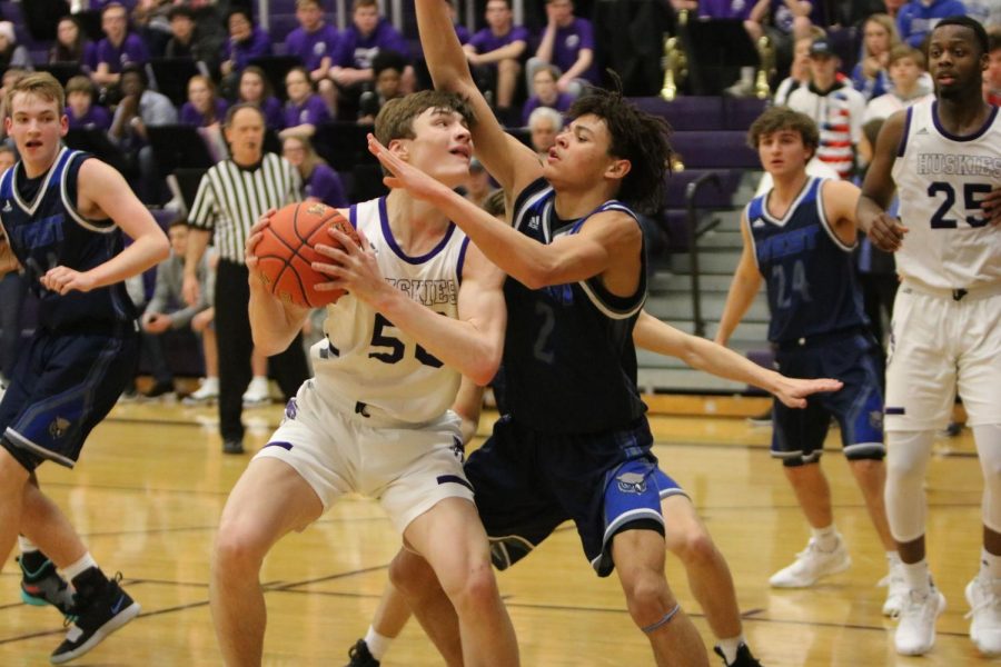 Senior Christian Braun wears teammate and fellow senior Matthew Chapmans jersey (50) in the game against Olathe West on March 1 at BVNW. The Huskies defeated the Owls, 71-64. 
