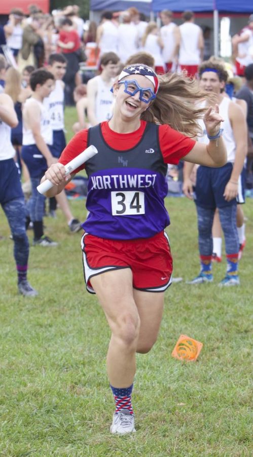 Junior Cydney Willenbring runs in the cross country relay while wearing USA attire, on Oct. 10.
