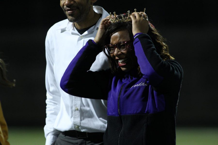 Senior Jordan Nevels smiles while receiving her crown during halftime of the homecoming football game, on Oct. 11. 