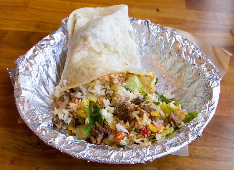 A+make+your+own+burrito+sits+in+an+aluminum+tray+at+Qdoba+on+135th+and+Metcalf.