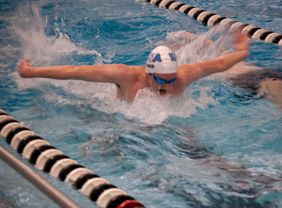Senior+Logan+Beaman+does+a+butterfly+stroke+while+practicing.