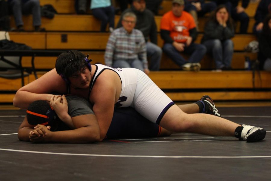 Senior+Danny+Robinson+holds+an+opponent+in+a+pin+on+Jan.+16.