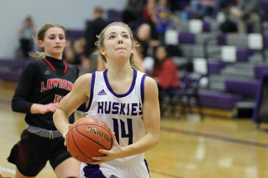 Junior Megan Edwards drives in for a layup on a fast break.