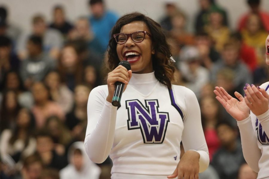 Senior cheerleading captain Jordan Nevels speaks during the cheerleading state championship assembly, on Dec. 2. 