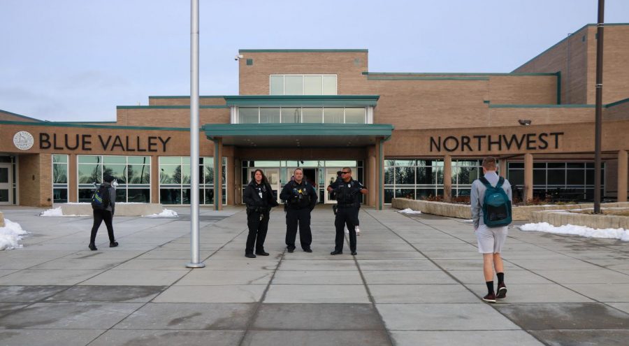OP Police Officers and SRO Officer Anthony Garcia stand outside the school Thursday morning during arrival. 
