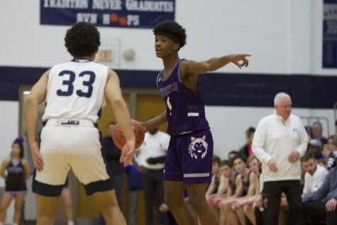 Junior Alston Mason motions for a play in the boys varsity basketball game against North on Jan. 17.