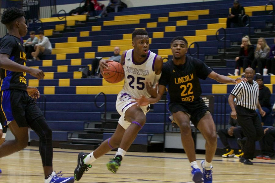 Senior guard Markell Hood (25) drives into the paint. He would finish the game with 10 points.