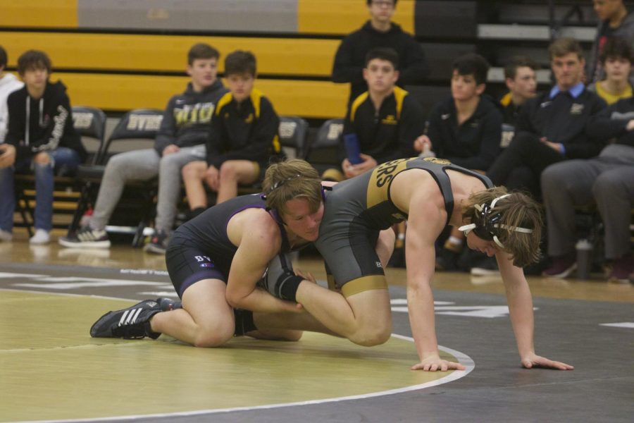  Sophomore Nicholas Mironov attempts to take down his opponent before eventually pinning him.